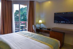 Voodi või voodid majutusasutuse Admas Grand Hotel toas
