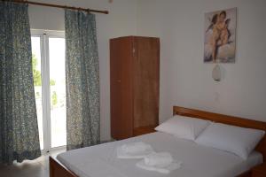Posteľ alebo postele v izbe v ubytovaní Red Sun Apartments