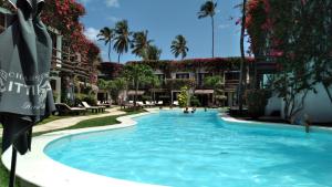 a swimming pool in the middle of a resort at Wind e Blue in Jericoacoara