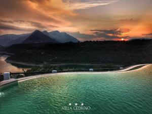 a large pool of water with a view of a mountain at Hotel Villa Cedrino in Dorgali