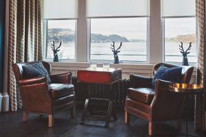 a living room filled with furniture and a window at No.26 By The Sea in Oban