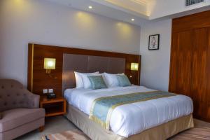 Voodi või voodid majutusasutuse Admas Grand Hotel toas