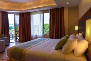 Voodi või voodid majutusasutuse Admas Grand Hotel toas