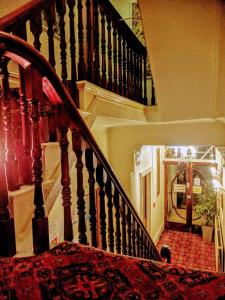 a spiral staircase in a house with a stair case at Gleneagles - Albert Road in Blackpool