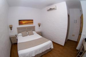 Postel nebo postele na pokoji v ubytování Hotel Almadraba