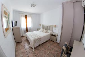 Postel nebo postele na pokoji v ubytování Hotel Almadraba