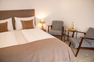 Fenix Hall Boutique Hotel Hallstatt客房内的一张或多张床位