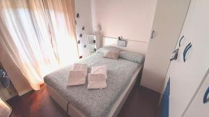A bed or beds in a room at L'angolo di Betti