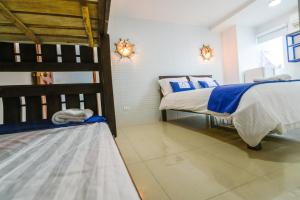 Postel nebo postele na pokoji v ubytování Hotel Aquarius