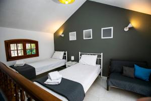 A bed or beds in a room at Villa Kouf