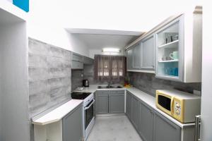 A kitchen or kitchenette at Villa Kouf