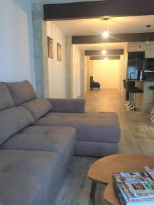 a living room with a couch and a table at FH ALTEA CENTRO PLAYA in Altea