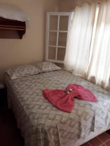 Un ou plusieurs lits dans un hébergement de l'établissement Suítes 239