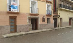a building on the side of a city street at Camino a Monasterio de piedra in Alhama de Aragón