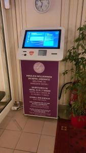 a computer sitting on top of a sign at Ambiente Hotel garni in Plauen