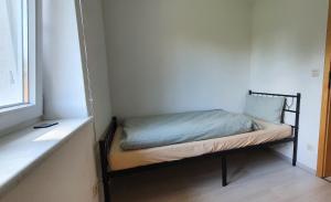Giường trong phòng chung tại FN City Bungalow