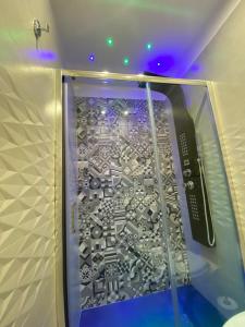 a room with a glass door with acomputer at Domus Leone Tre in Naples