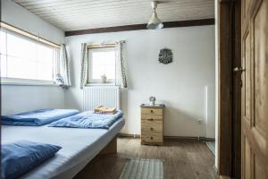 Postel nebo postele na pokoji v ubytování Ve Stodole