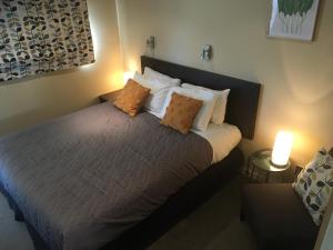 Postel nebo postele na pokoji v ubytování Kauri Motel on Riccarton