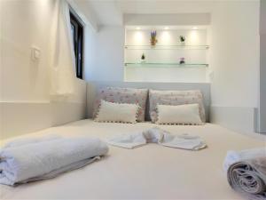 a bedroom with two towels on a bed at 7. Luxurious sea view rooftop suite in the center! in Rhodes Town