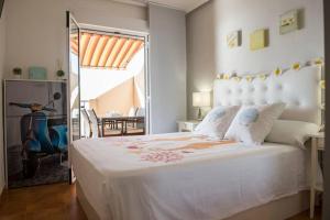 En eller flere senge i et værelse på Precioso apartamento frente al mar