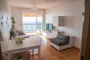 Area tempat duduk di Precioso apartamento frente al mar