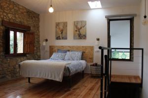 Llit o llits en una habitació de El llagar - Sagasta Rural Oviedo