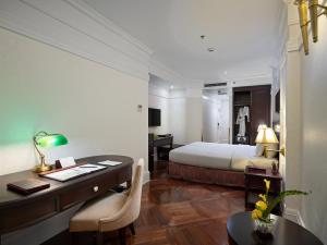 Ένα ή περισσότερα κρεβάτια σε δωμάτιο στο Silk Path Boutique Hanoi
