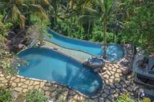 an overhead view of a swimming pool in a resort at Bucu View Resort in Ubud