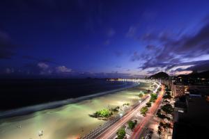 a view of the beach at night at PortoBay Rio de Janeiro in Rio de Janeiro