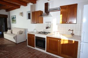 A kitchen or kitchenette at Serravalle Relais & Country Villa with private pool - Esclusive use