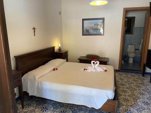 Voodi või voodid majutusasutuse Hotel Al Togo Fitness & Relax toas