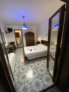 Voodi või voodid majutusasutuse Hotel Al Togo Fitness & Relax toas