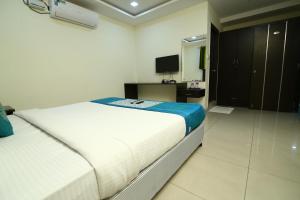 Hotel Siri Inn tesisinde bir odada yatak veya yataklar