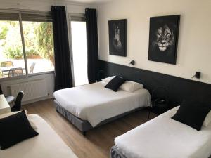 Postel nebo postele na pokoji v ubytování Logis Hôtel l'Abricotine