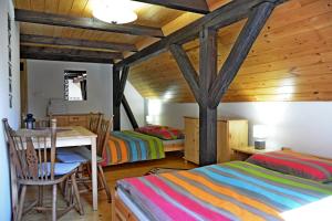 Postel nebo postele na pokoji v ubytování Chalupa Rozálka - ubytování u Adršpachu + 22 fotografií