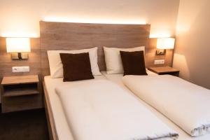 Postel nebo postele na pokoji v ubytování Hotel Lutter