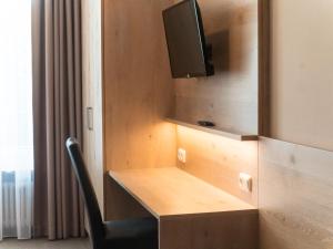 TV a/nebo společenská místnost v ubytování Hotel Lutter