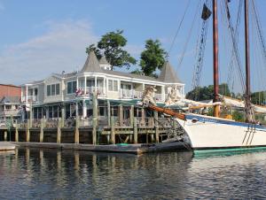 a large house on a boat in the water at Grand Harbor Inn in Camden