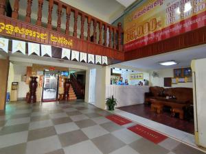 a lobby of a building with a restaurant at Spean Meas Hotel in Phnom Penh