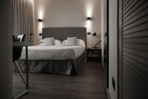 Postel nebo postele na pokoji v ubytování Hotel Select Suites & Spa - Apartments