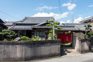 a house with a fence in front of it at Hostel 東風ノ家（Kochi-no-ya） in Aki +37 photos