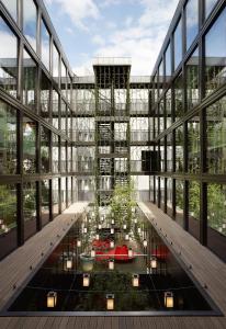eine Darstellung eines Gebäudes mit einem Garten in der Mitte in der Unterkunft citizenM London Bankside in London