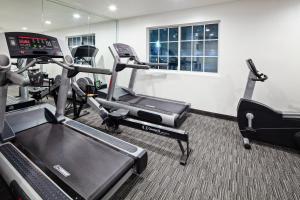a gym with several tread machines in a room at Holiday Inn Express Hollywood Walk of Fame by IHG in Los Angeles