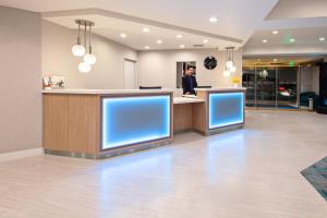 a lobby of a hospital with blue screens at Holiday Inn Express Hollywood Walk of Fame by IHG in Los Angeles +37 photos