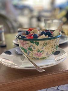 a bowl of olives on a plate on a table at EL GUSTO HOMES Park in Sopron