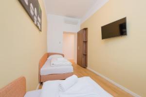 Ένα ή περισσότερα κρεβάτια σε δωμάτιο στο Vienna Stay Apartments or Rooms 1050
