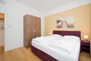 Ένα ή περισσότερα κρεβάτια σε δωμάτιο στο Vienna Stay Apartments or Rooms 1050