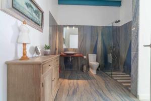 a bathroom with a sink and a toilet at Long House Ses Salines in Ses Salines +23 photos