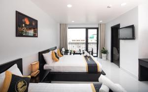 TV a/nebo společenská místnost v ubytování Hoang Long Hotel Phan Thiết